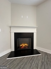 11164 Cornerstone Lane Hampton, GA 30228 - Photo 12 of 28 a living room with a fireplace