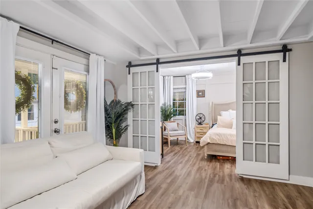 a bathroom with a granite countertop sink a toilet and bathtub