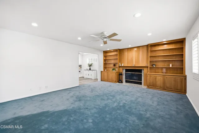 a view of an entryway with wooden floor and a potted plant
