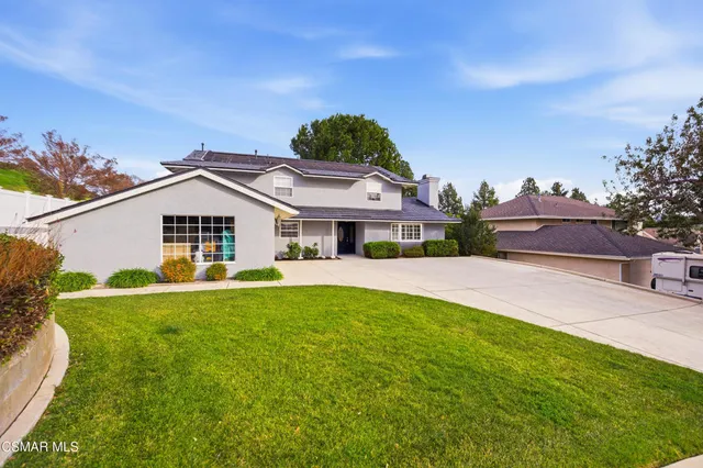 a view of a kitchen with a sink dishwasher cabinets and a kitchen