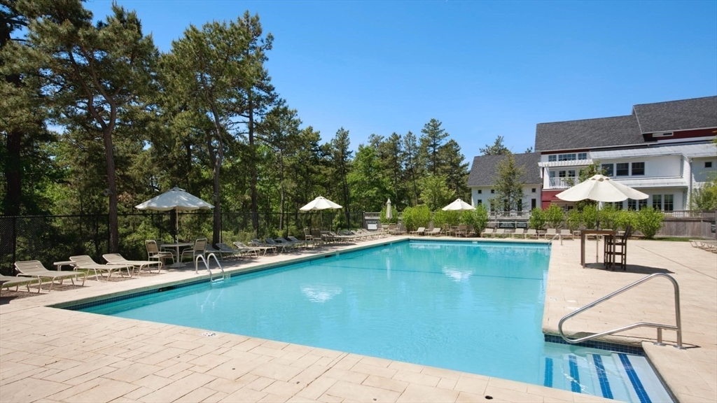 9 Broadleaf, Unit 4 Plymouth, MA 02360 - Photo 14 of 17 a swimming pool with outdoor seating and yard