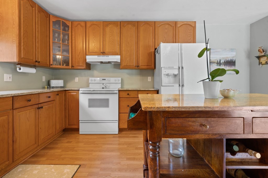 5597 South No Pone Valley Road Decatur, TN 37322 - Photo 15 of 44 a kitchen with a stove a refrigerator and sink
