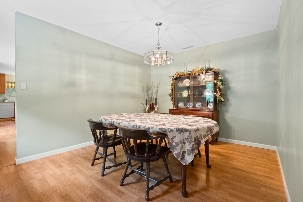 5597 South No Pone Valley Road Decatur, TN 37322 - Photo 20 of 44 a dining room with furniture wooden floor and a chandelier