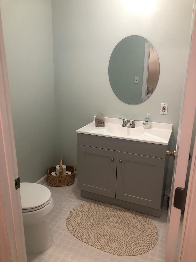 5597 South No Pone Valley Road Decatur, TN 37322 - Photo 25 of 44 a bathroom with a sink toilet and mirror