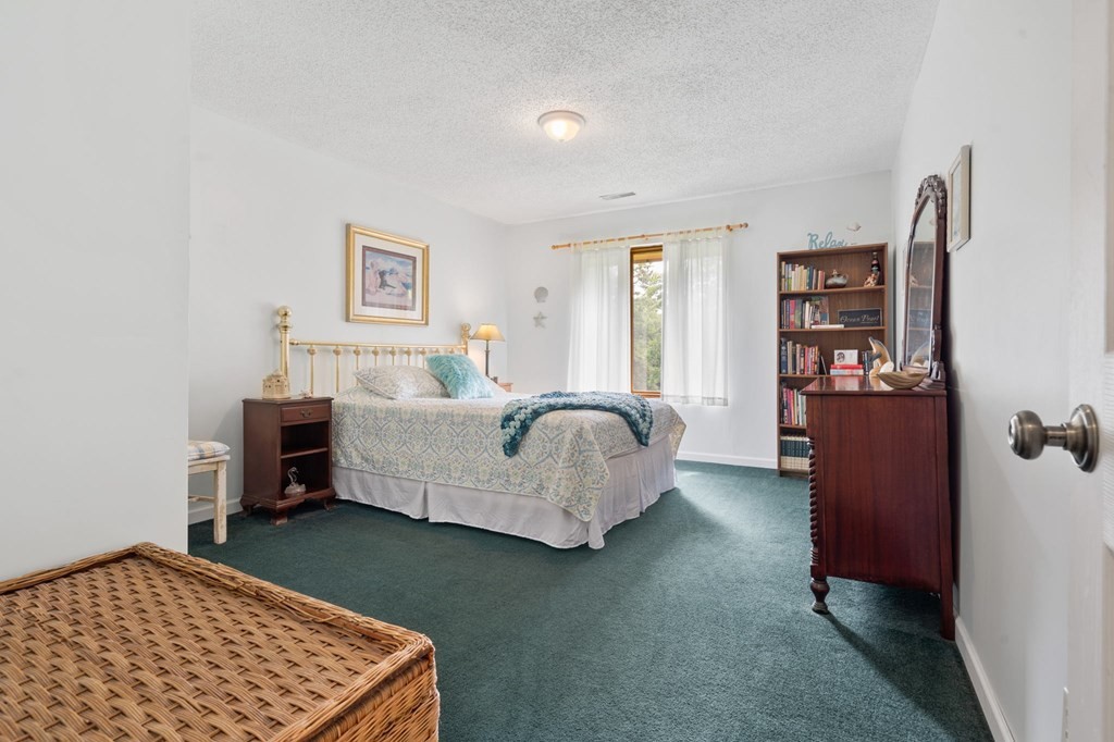 5597 South No Pone Valley Road Decatur, TN 37322 - Photo 26 of 44 a bedroom with furniture and a bed