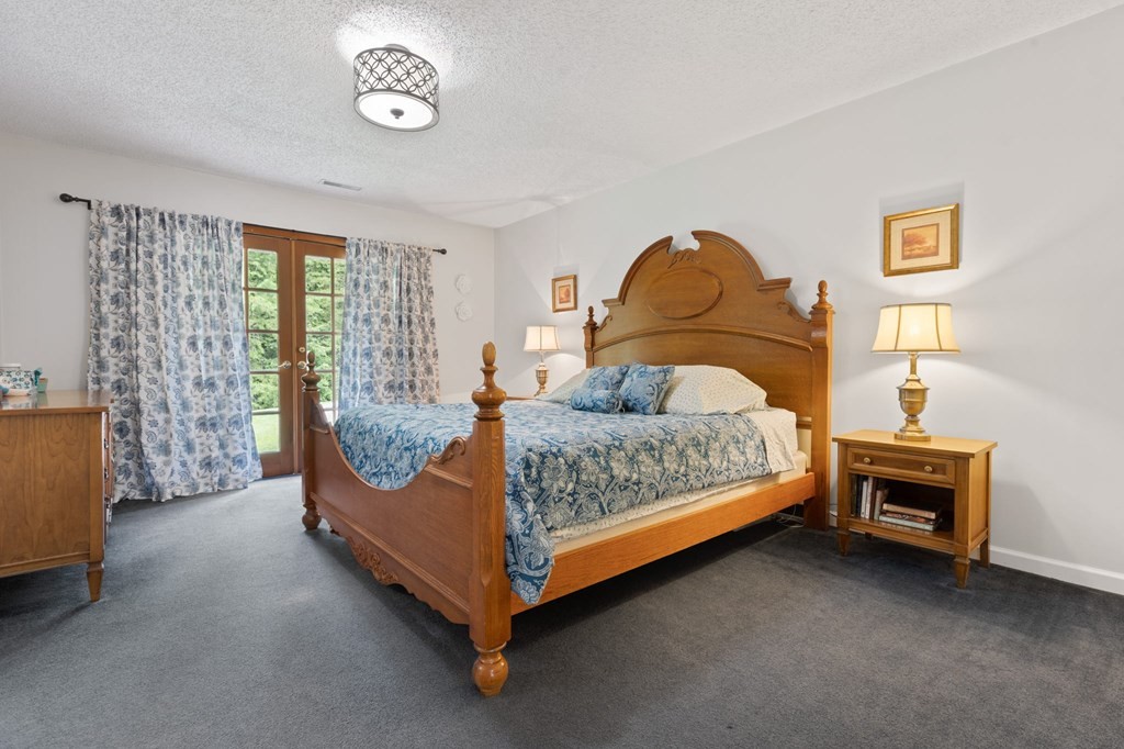5597 South No Pone Valley Road Decatur, TN 37322 - Photo 29 of 44 a bedroom with a bed and a window