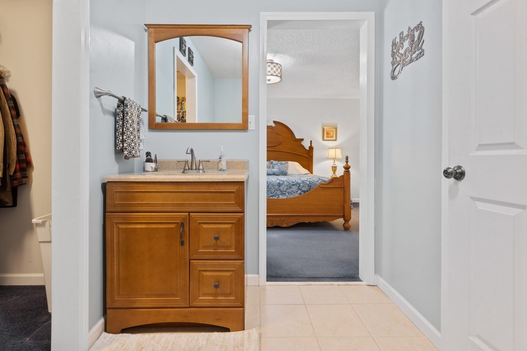 5597 South No Pone Valley Road Decatur, TN 37322 - Photo 32 of 44 a en suite bathroom with a sink and a mirror