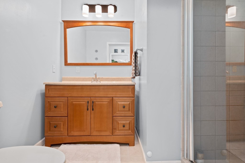 5597 South No Pone Valley Road Decatur, TN 37322 - Photo 33 of 44 a bathroom with a sink a mirror and vanity
