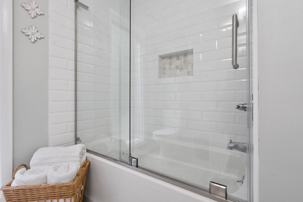 5597 South No Pone Valley Road Decatur, TN 37322 - Photo 36 of 44 a bathroom with a tub shower and toilet