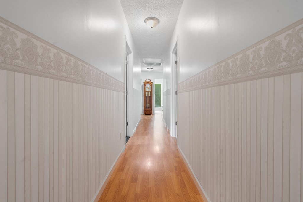 5597 South No Pone Valley Road Decatur, TN 37322 - Photo 39 of 44 a view of a hallway with wooden floor