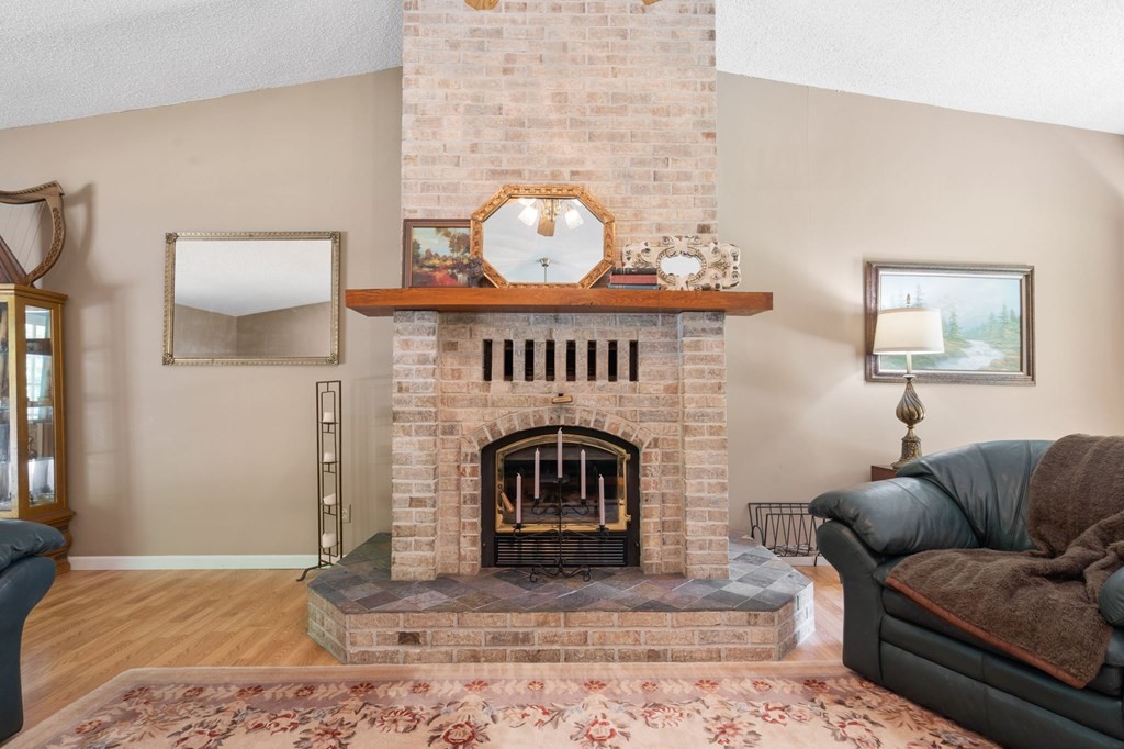 5597 South No Pone Valley Road Decatur, TN 37322 - Photo 10 of 44 a living room with furniture a couch and a fireplace