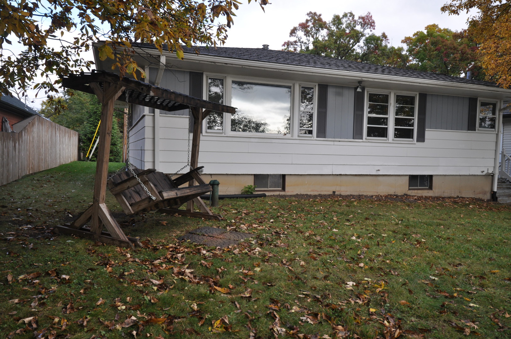 a house view with a backyard space