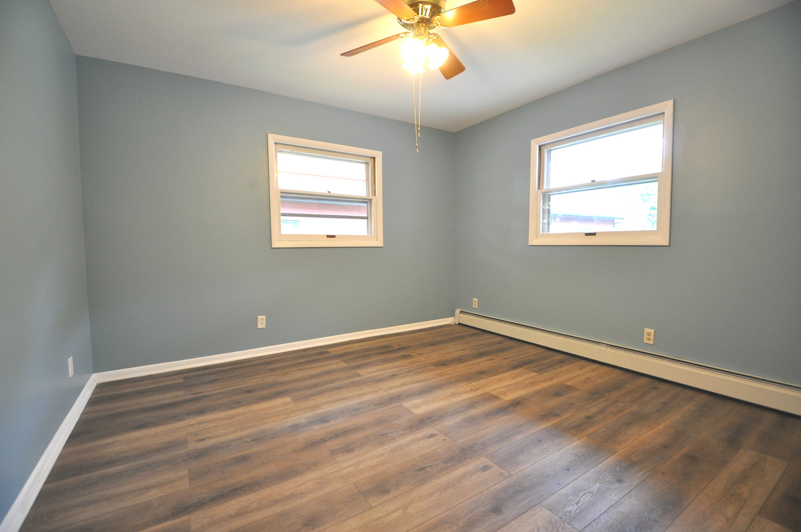 24111 64th Place Paddock Lake, WI 53168 - Photo 8 of 11 a view of an empty room with wooden floor and a window