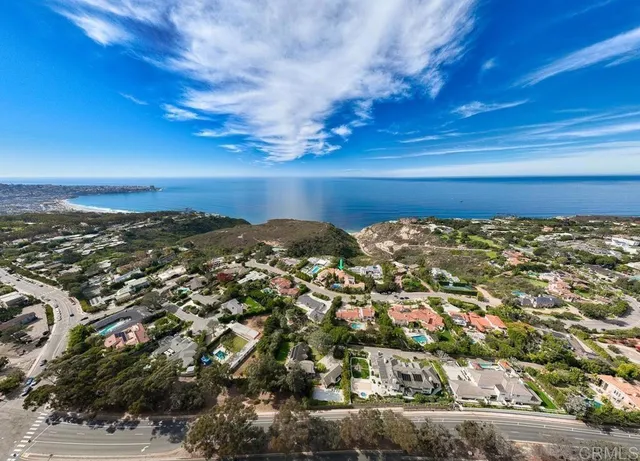 an aerial view of a house with a lake view