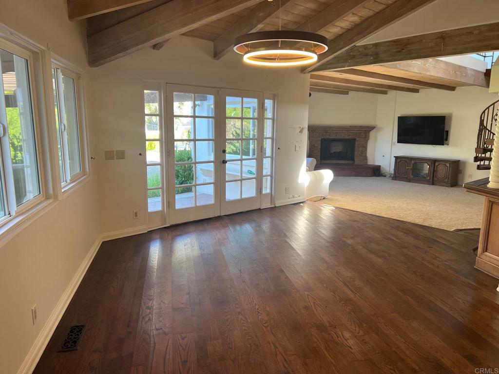 9450 La Jolla Farms Road La Jolla, CA 92037 - Photo 23 of 29 a view of an empty room with wooden floor and a window