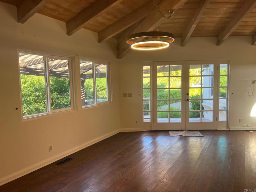 9450 La Jolla Farms Road La Jolla, CA 92037 - Photo 24 of 29 a view of an empty room with wooden floor and a window