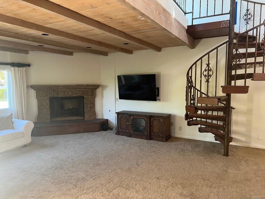 9450 La Jolla Farms Road La Jolla, CA 92037 - Photo 26 of 29 a living room with furniture and a flat screen tv
