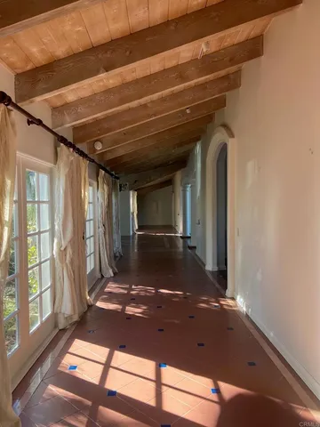 a view of a livingroom with a fireplace and window