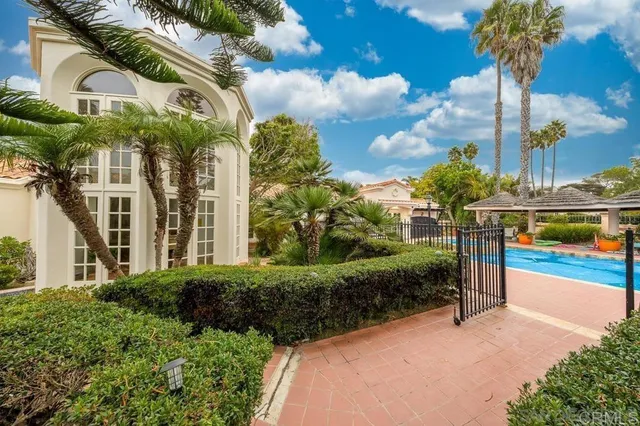 a front view of a building with garden