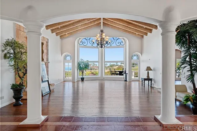 a view of a living room and chandelier