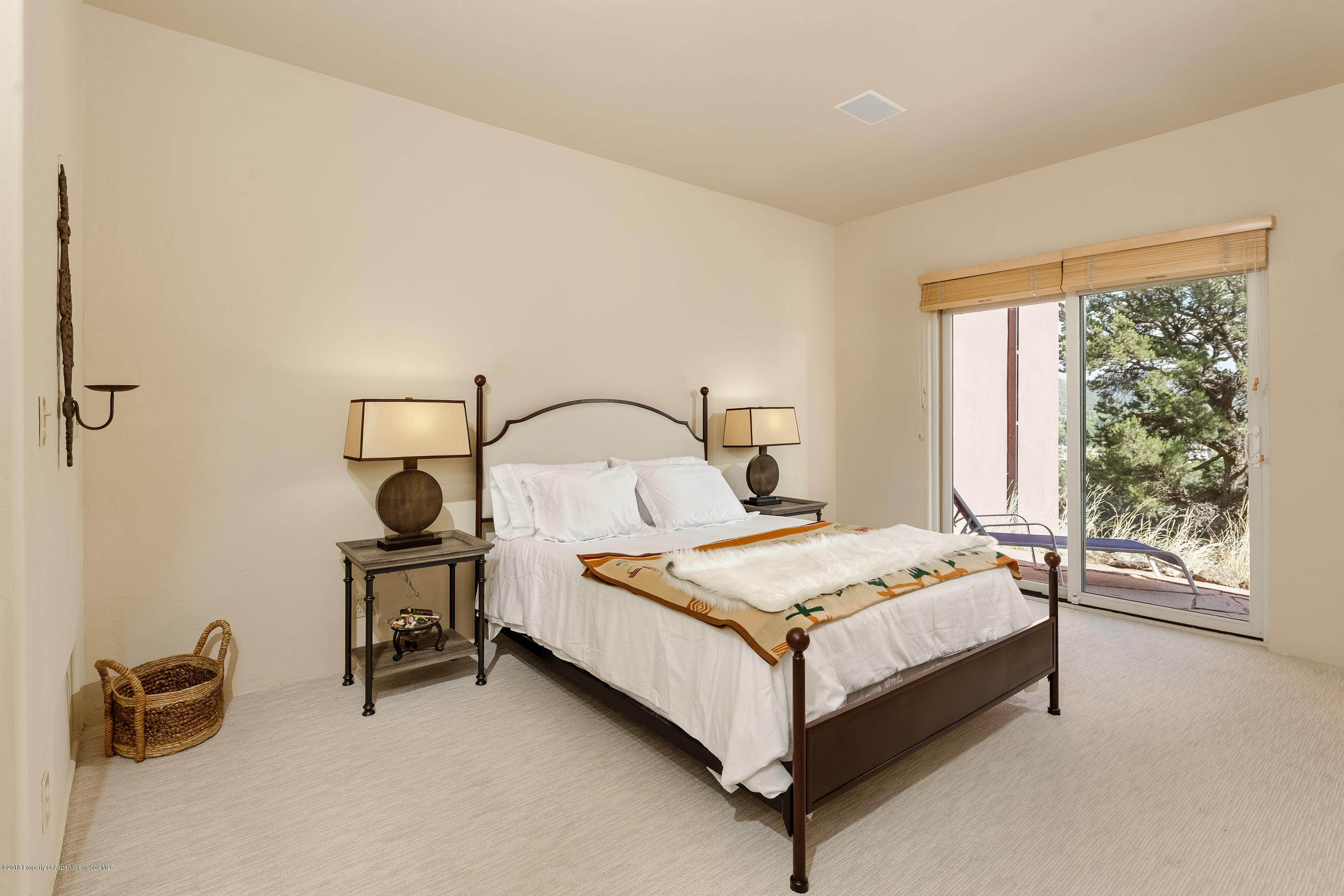 404 Wild Spring Lane Basalt, CO 81621 - Photo 11 of 25 a bed sitting in a room next to a window