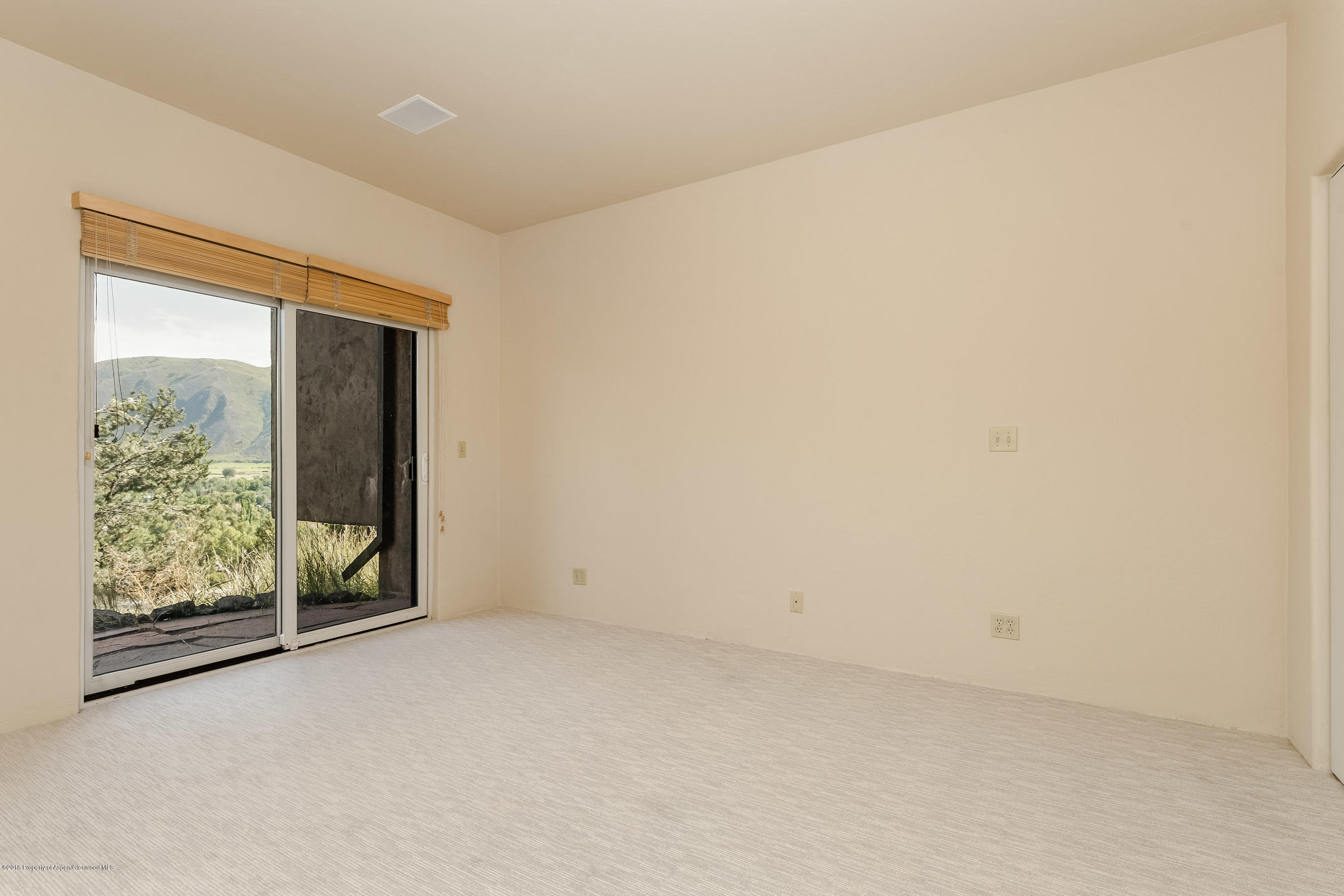 404 Wild Spring Lane Basalt, CO 81621 - Photo 15 of 25 an empty room with windows