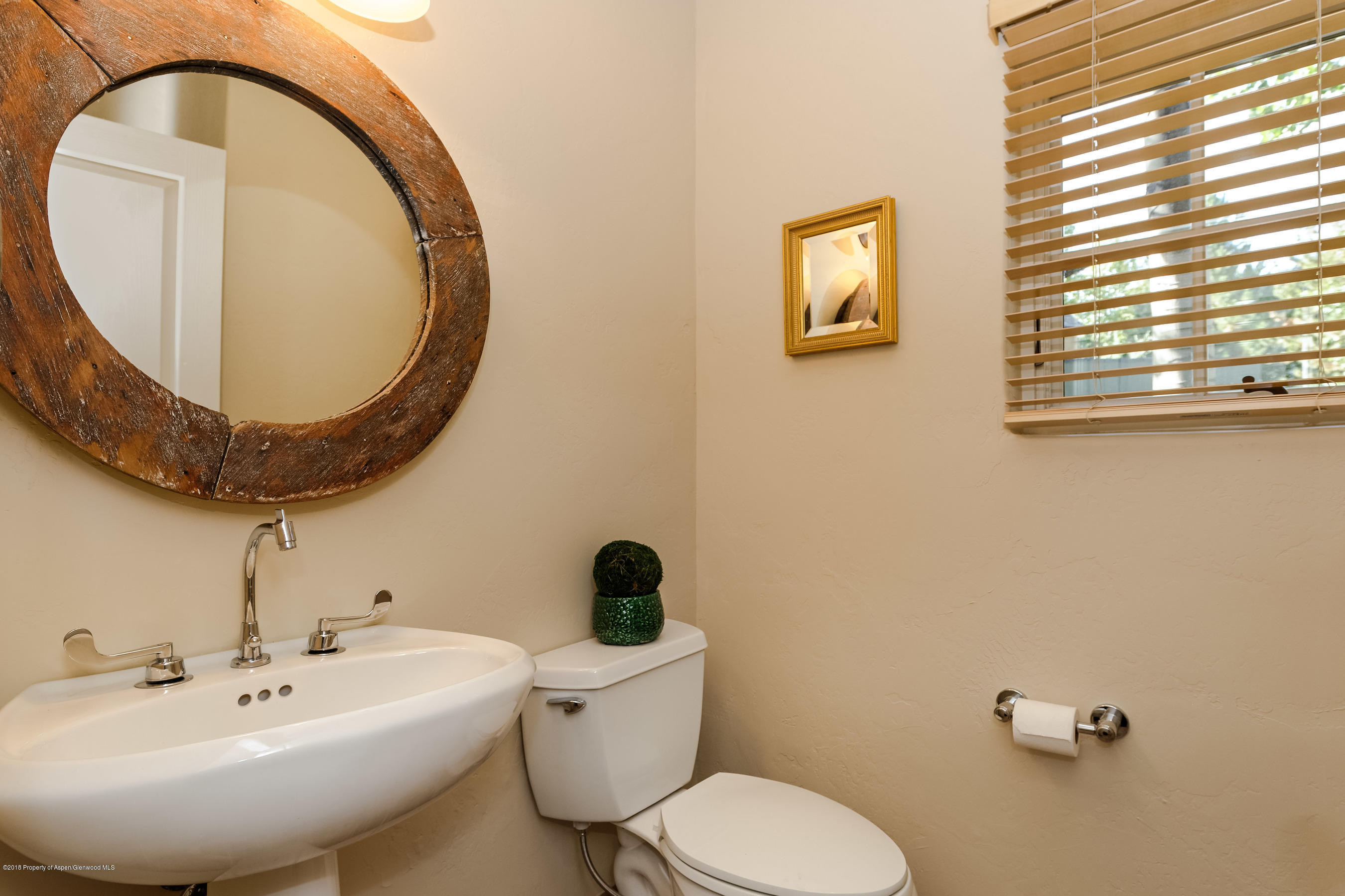 404 Wild Spring Lane Basalt, CO 81621 - Photo 16 of 25 a bathroom with a toilet sink and mirror