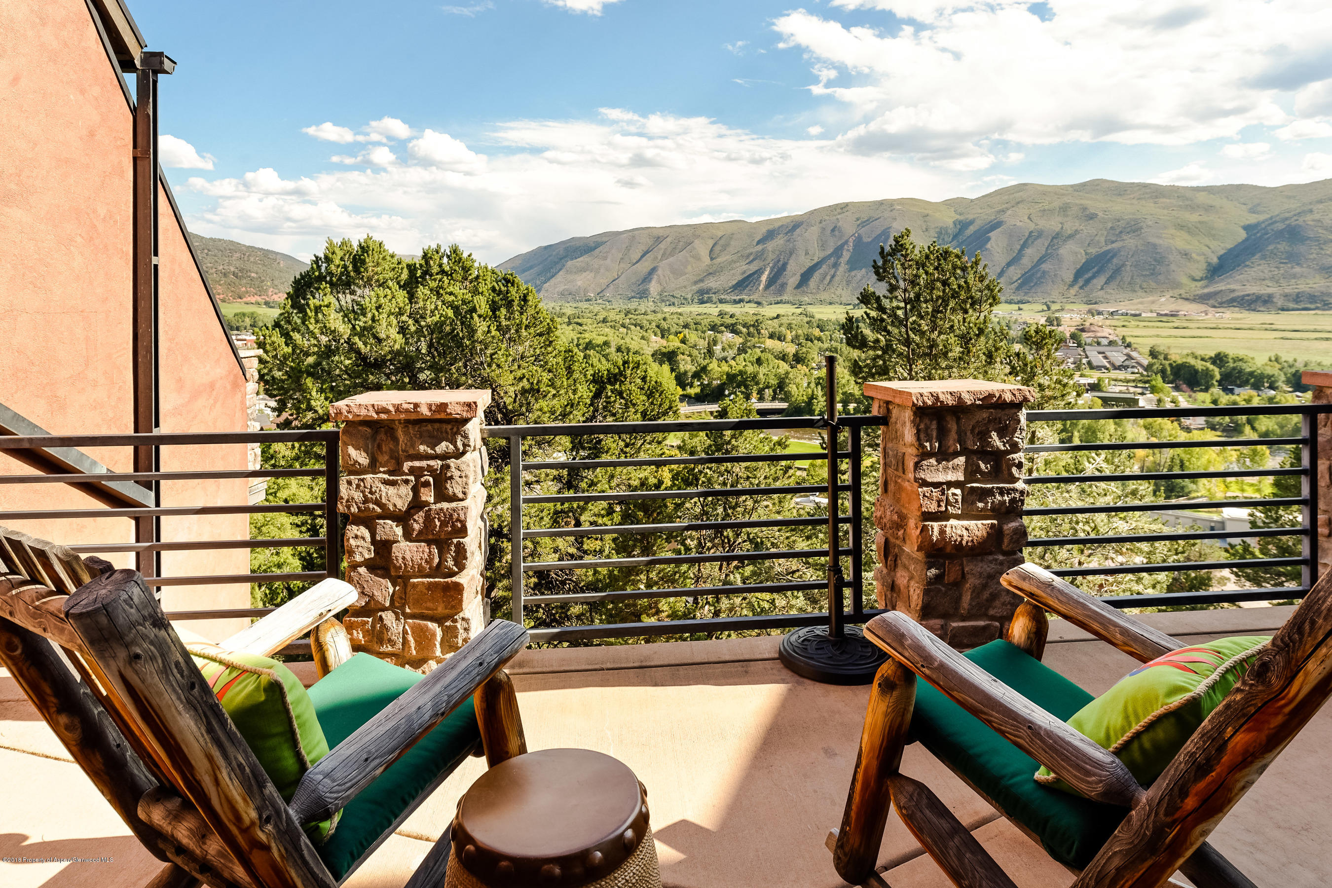 404 Wild Spring Lane Basalt, CO 81621 - Photo 2 of 25 a view of a chairs and tables in the balcony
