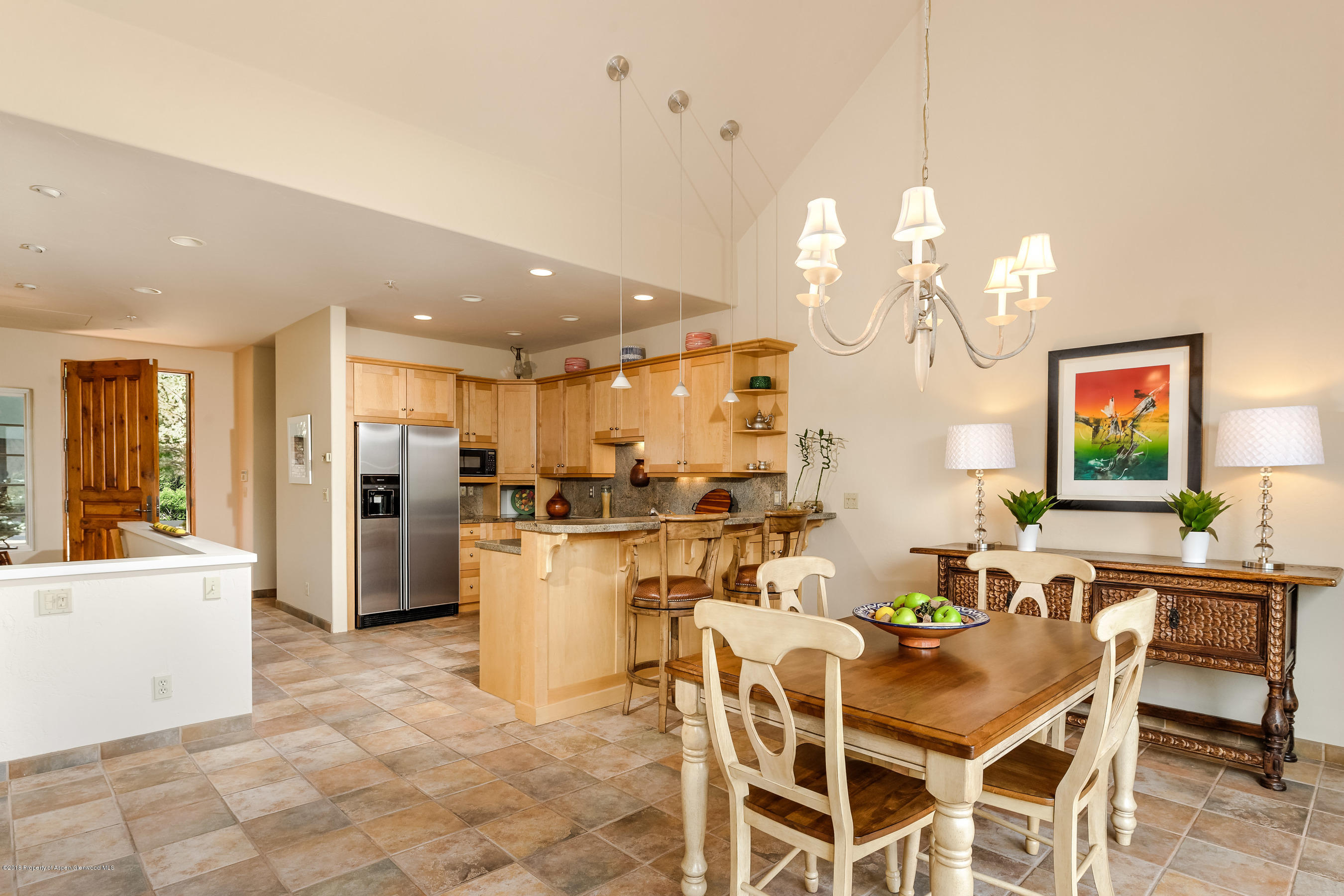 404 Wild Spring Lane Basalt, CO 81621 - Photo 10 of 25 a dinning room and kitchen with a dining table chairs