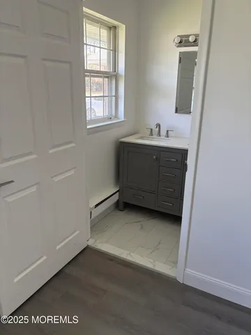 a bathroom with a sink and a mirror