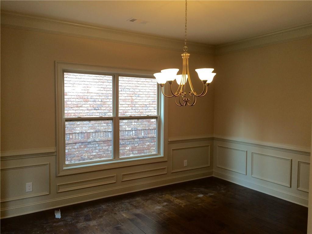 718 Channel Lane Lawrenceville, GA 30046 - Photo 7 of 16 a room with a window and a chandelier