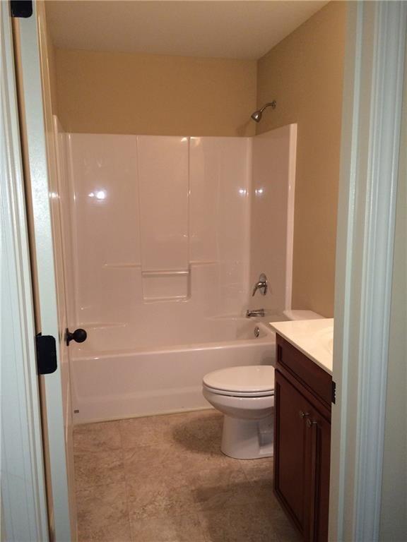 718 Channel Lane Lawrenceville, GA 30046 - Photo 10 of 16 a bathroom with a toilet a sink and bathtub