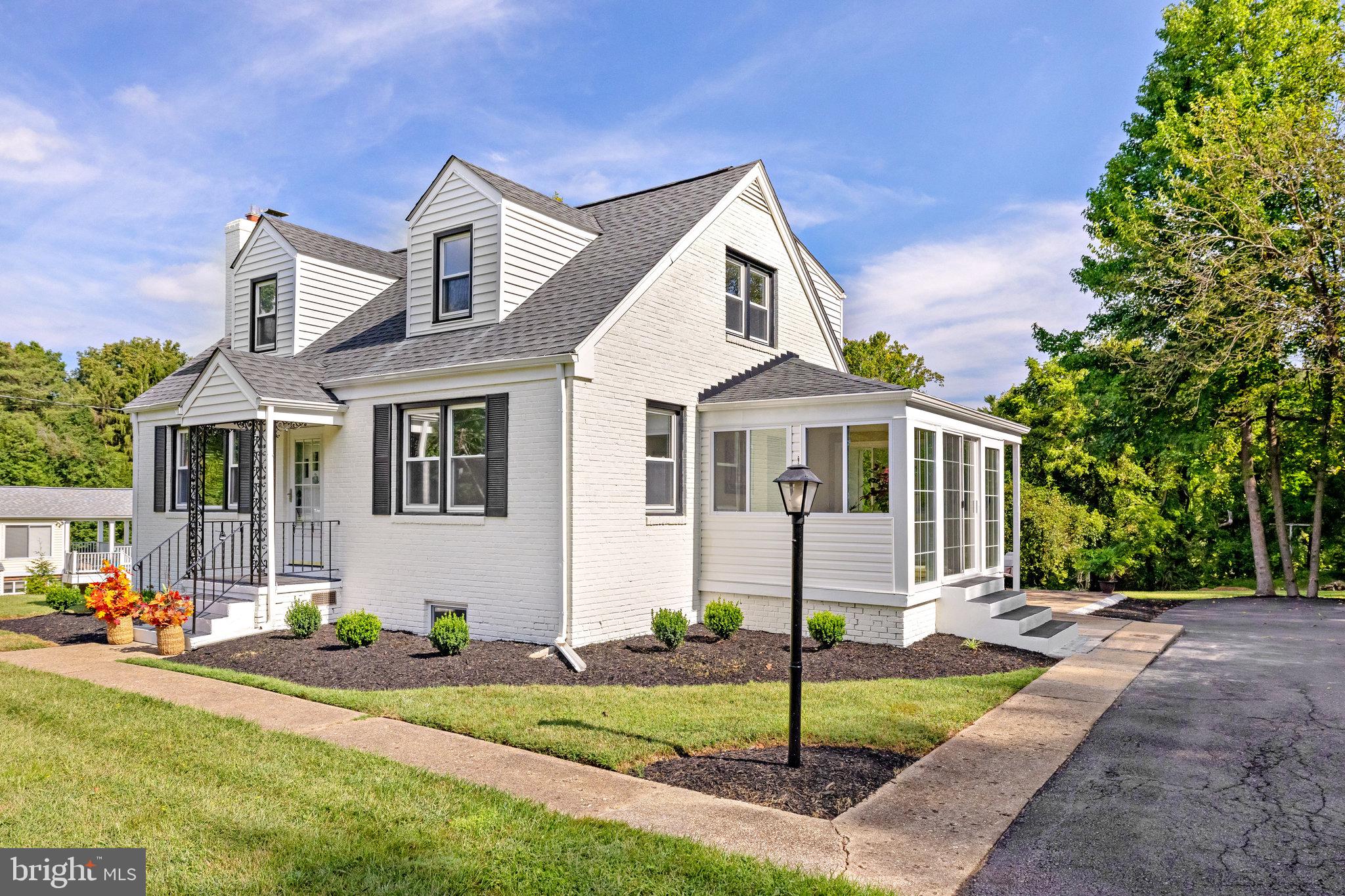 11410 Waples Mill Road Oakton, VA 22124 - Photo 3 of 62 Charming home with lush greenery.