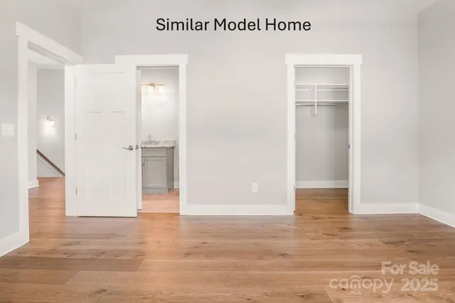 a bathroom with a granite countertop sink a toilet and bathtub