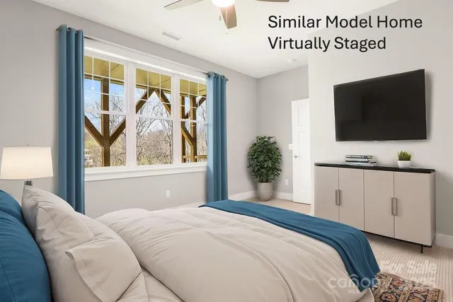 a view of a workspace with furniture and a bookshelf