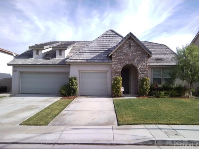8228 Lavender Lane Riverside, CA 92508 - Photo 1 of 1 a front view of a house with a yard and garage