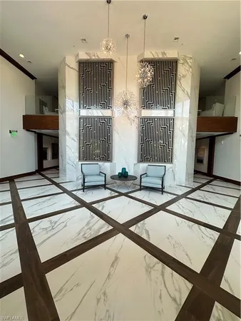 a lobby with furniture and window