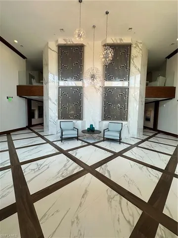 a lobby with furniture and window