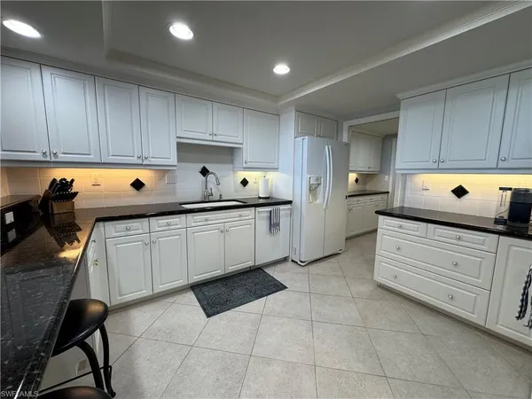 a kitchen with a cabinets and window