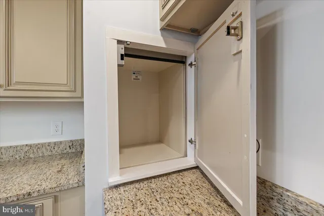 a kitchen with stainless steel appliances granite countertop a stove and a microwave