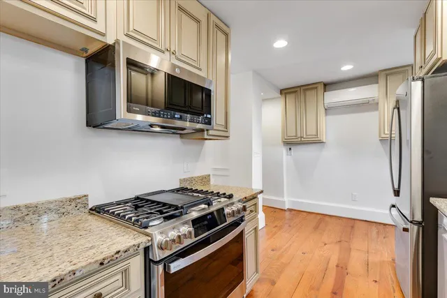 a view of kitchen with wooden floor and window