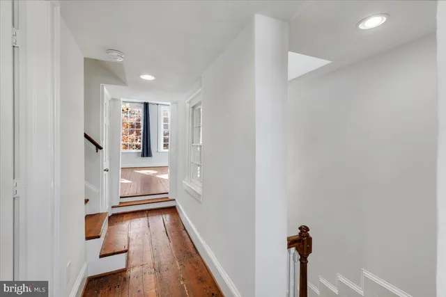 a view of balcony with wooden floor and outdoor seating