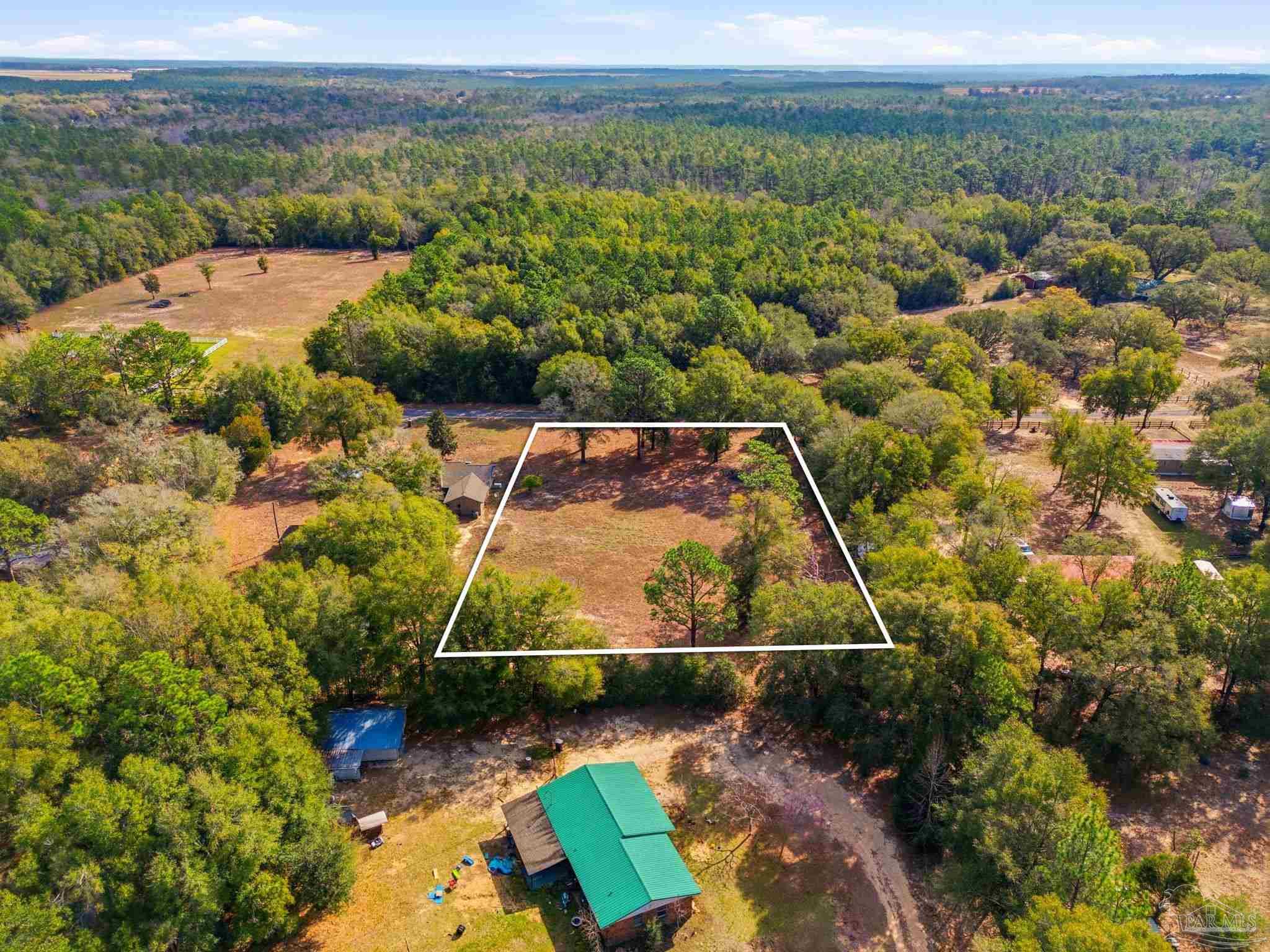 0 Howard Lane Milton, FL 32570 - Photo 6 of 9 a view of a yard