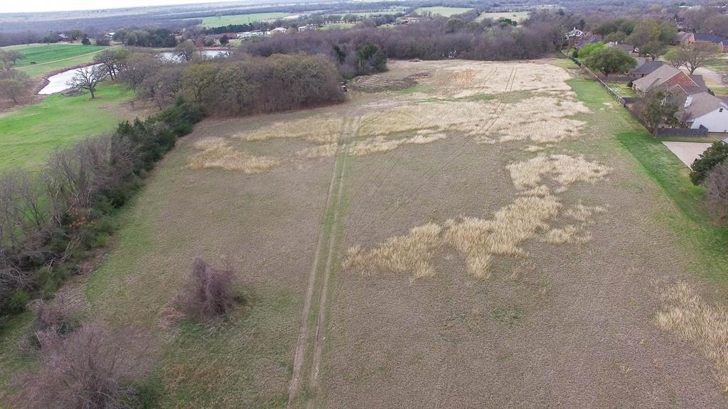 0 South Houston Street Kaufman, TX 75142 - Photo 7 of 7 a view of a dry yard with wooden floor and fence