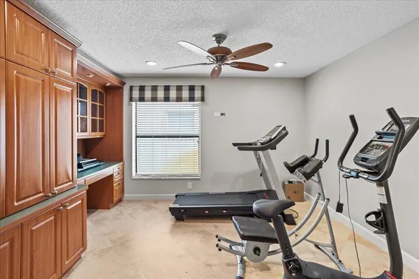 a room with gym equipment and a window