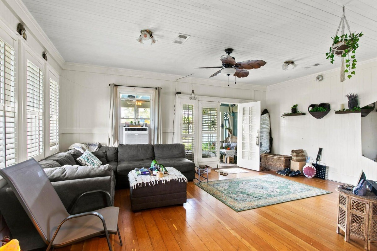 1054 Kealoha Road, Unit 2 Kapaa, HI 96746 - Photo 2 of 13 a living room with furniture and a large window