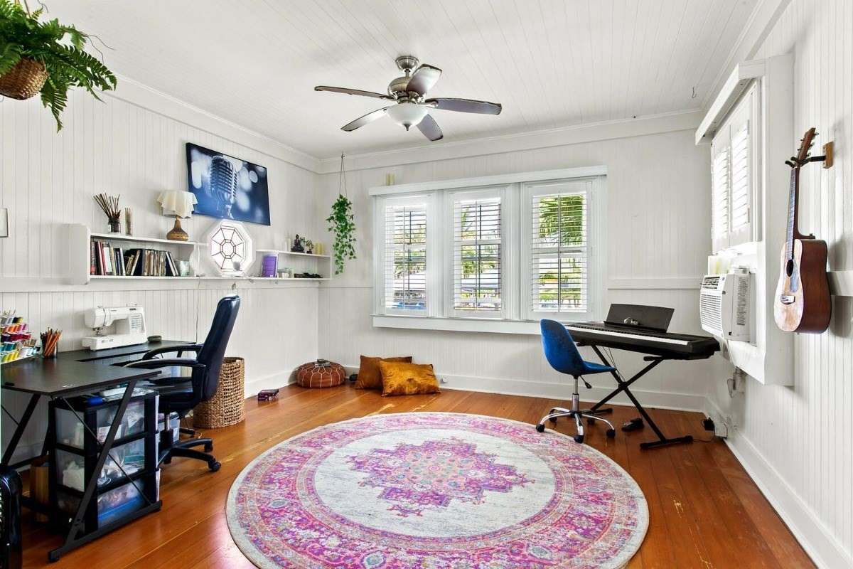1054 Kealoha Road, Unit 2 Kapaa, HI 96746 - Photo 4 of 13 a workspace with furniture and wooden floor