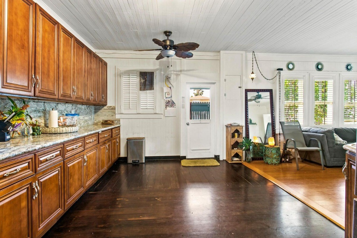 1054 Kealoha Road, Unit 2 Kapaa, HI 96746 - Photo 7 of 13 a kitchen with stainless steel appliances granite countertop a stove a sink and a refrigerator