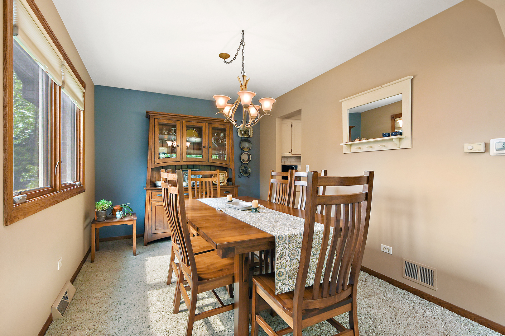 10918 3rd Street Mokena, IL 60448 - Photo 16 of 40 a view of a dining room with furniture and chandelier