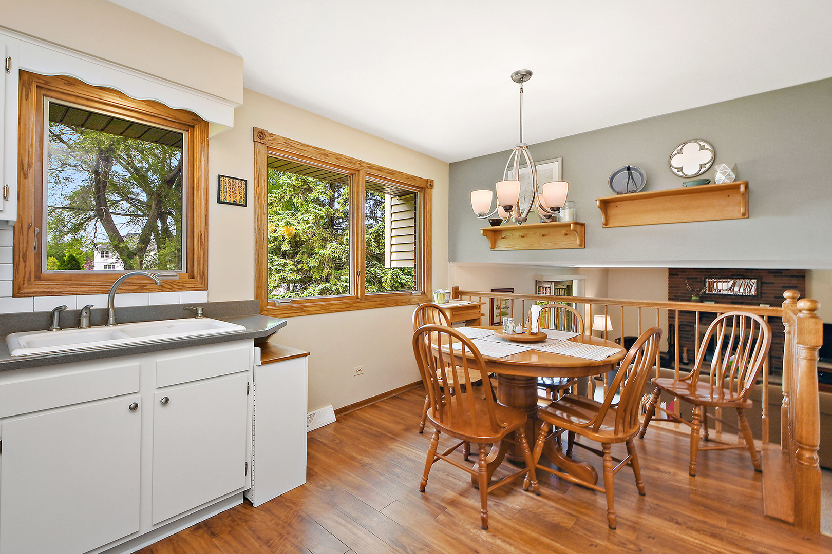 10918 3rd Street Mokena, IL 60448 - Photo 19 of 40 a dining room with furniture a chandelier and wooden floor